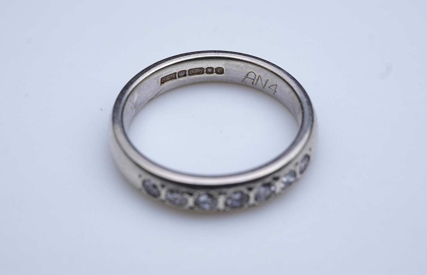 A diamond ring and two gold wedding rings